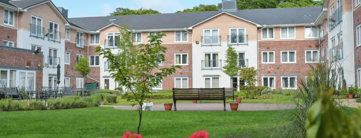 The landscaped courtyard and apartment buildings at Heyeswood Retirement Village in Haydock