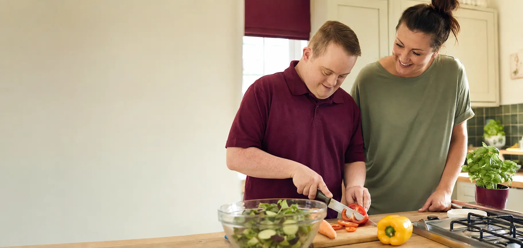 An adult preparing a healthy meal with support in his own home