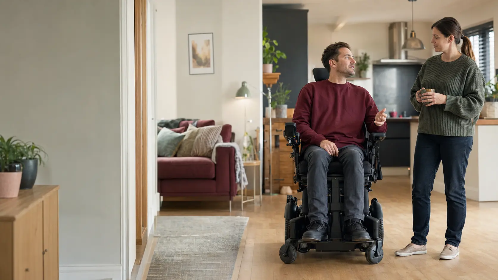 An adult wheelchair user directing his spinal injury support at home